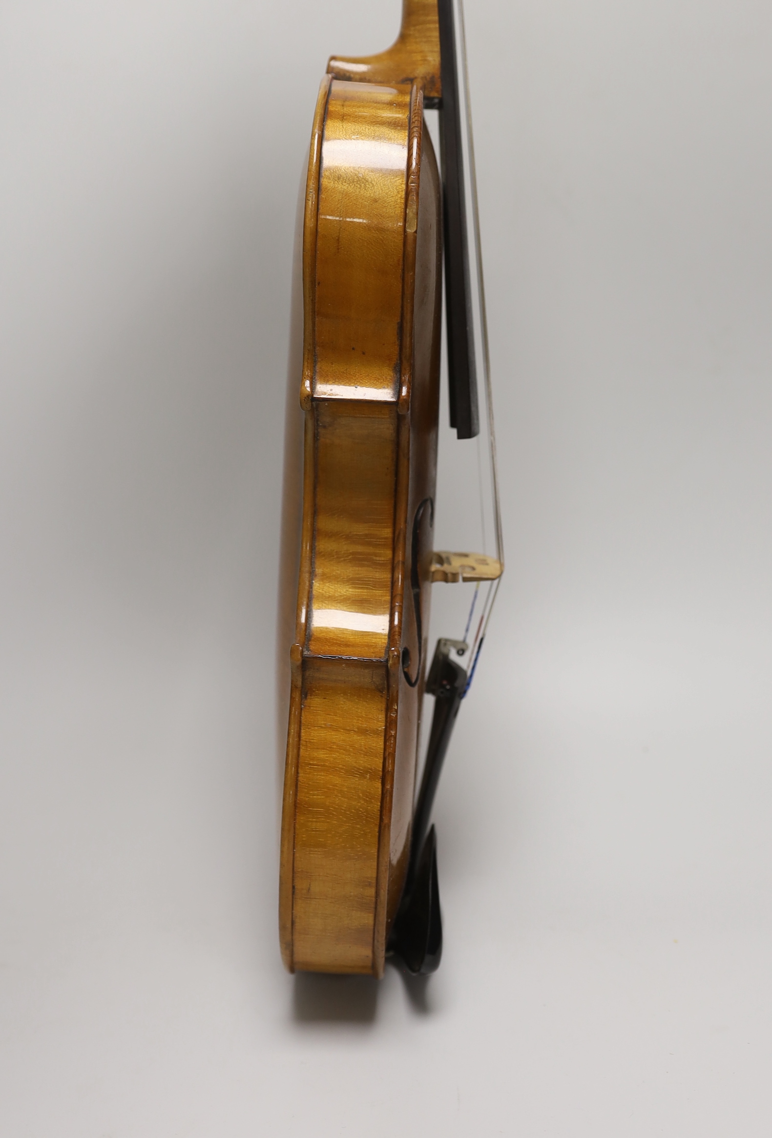 Likely German, a cased violin, late 19th/early 20th century, the back 14 inches in length
